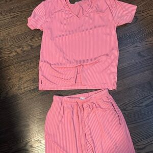 Woman’s pink pajama set, never worn, size S